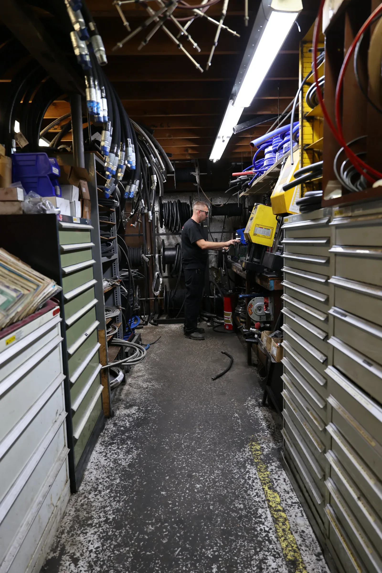 Team member working in the hydraulic hose shop