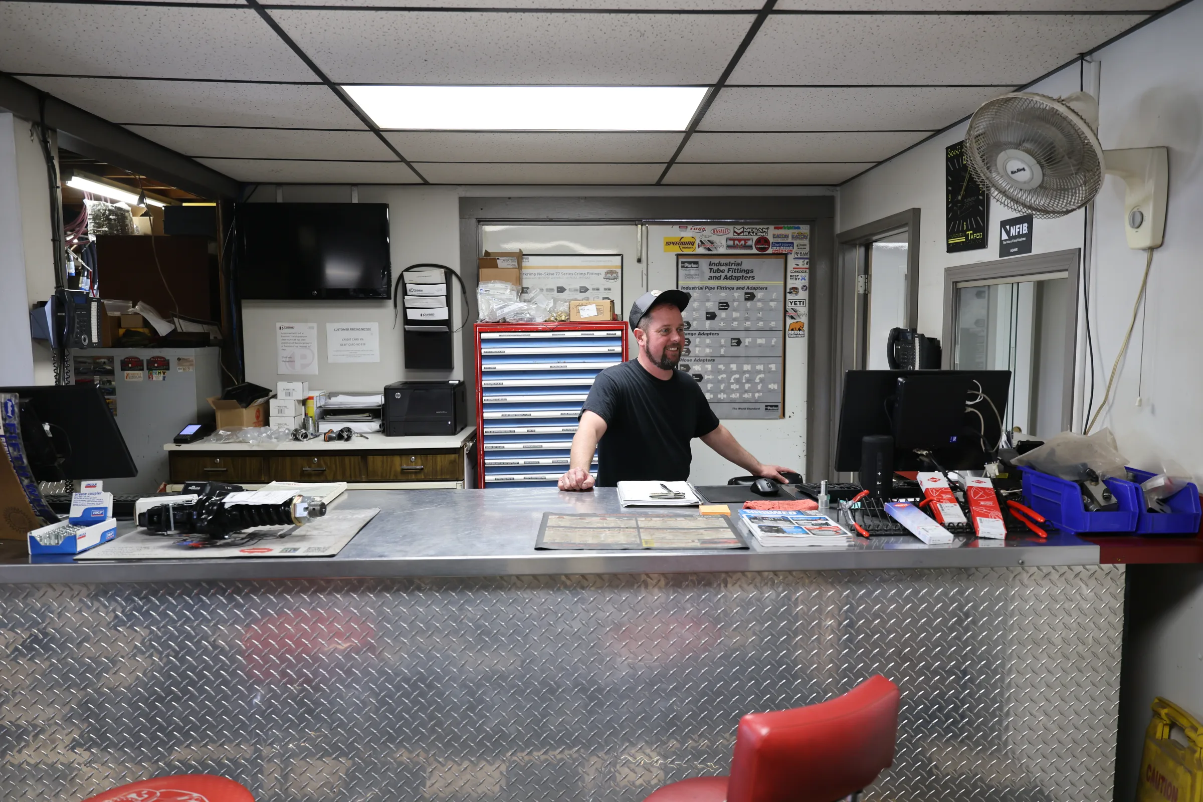 Precision Truck Equipment parts counter and team member