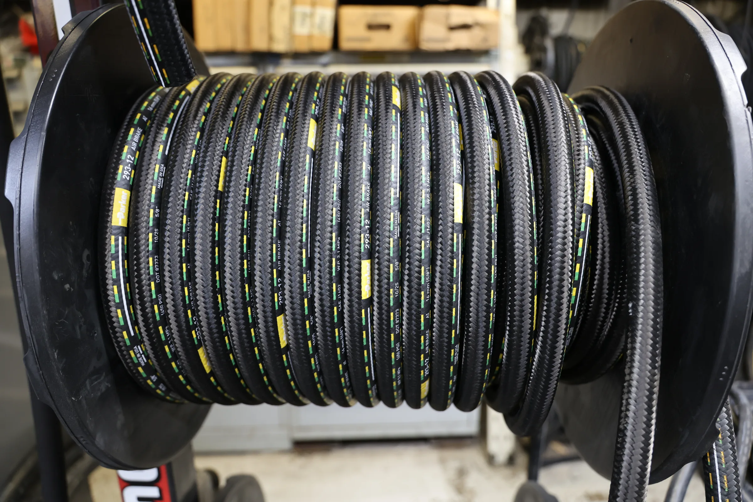 Heavy-duty hydraulic hose on a shop spool