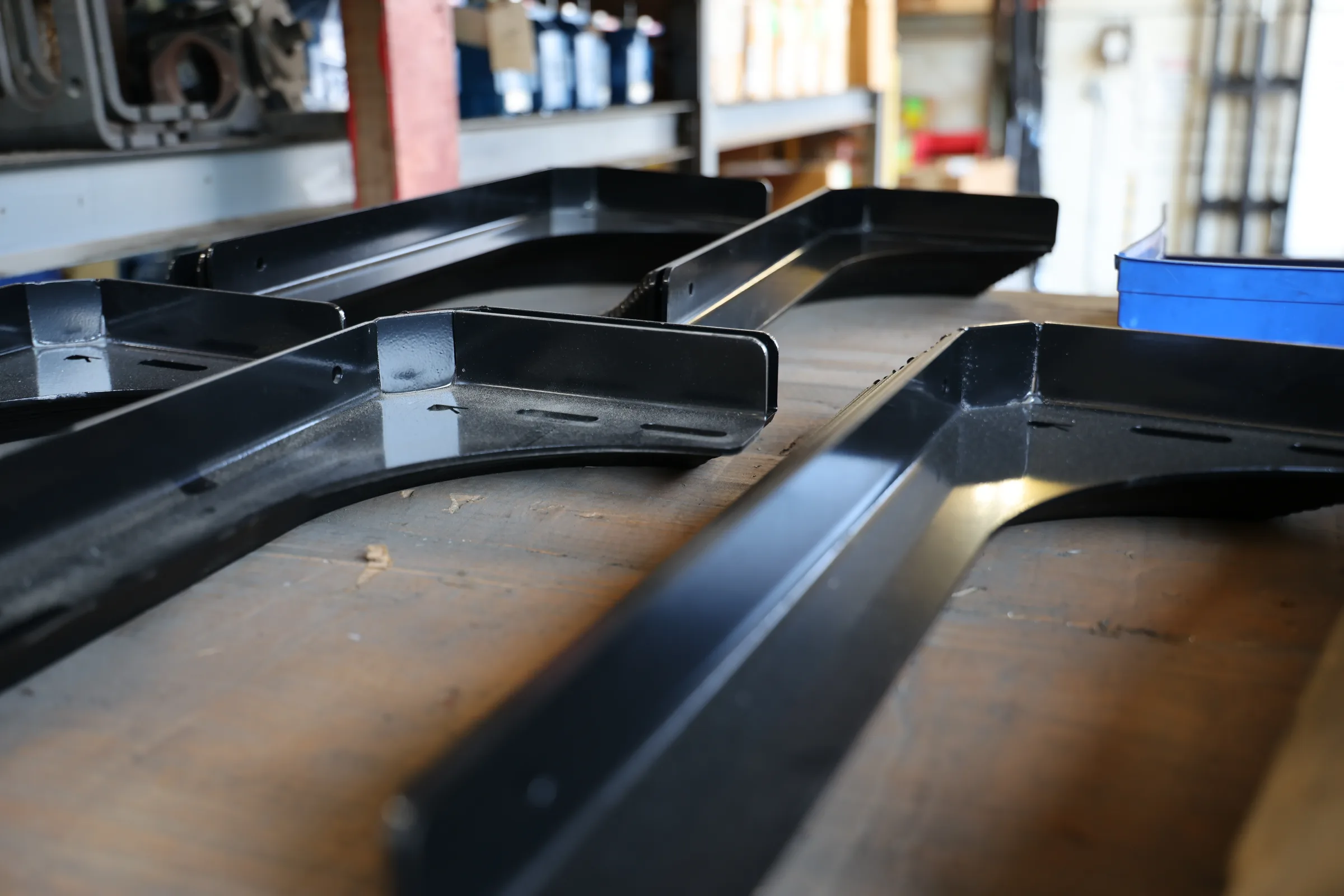 Custom-fabricated black metal brackets