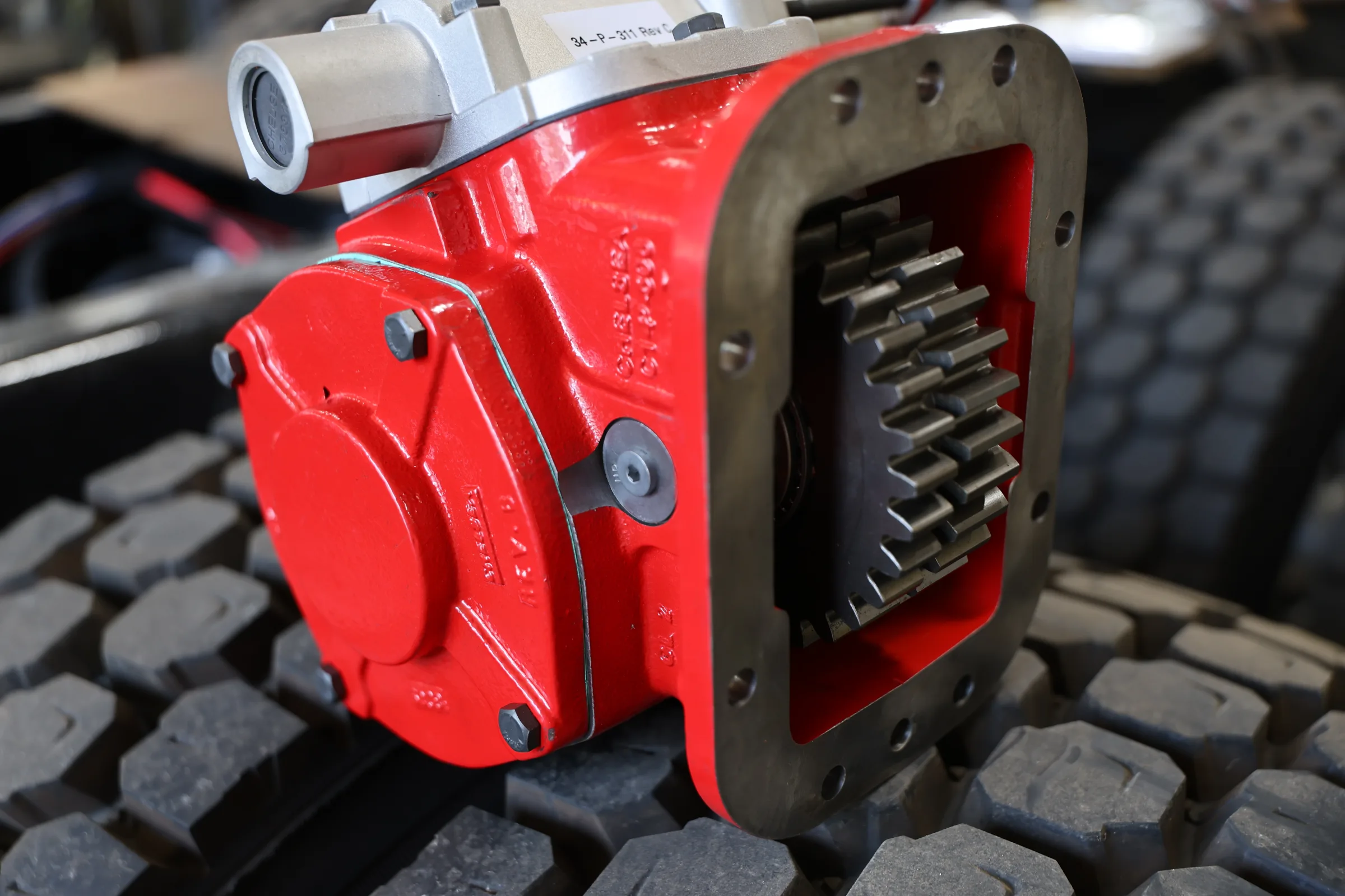 Red power take-off unit for a commercial truck