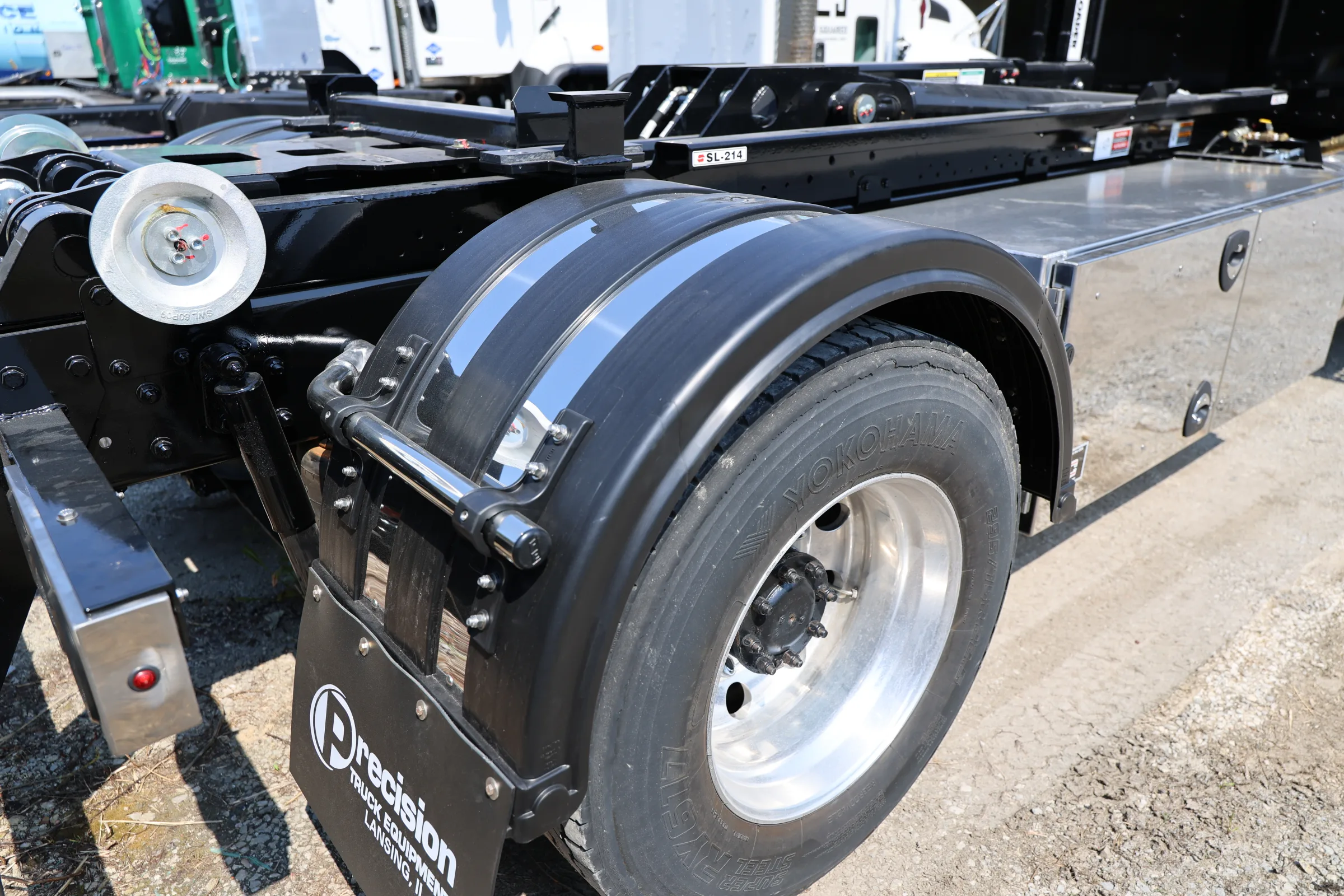 Custom black fenders and polished toolbox on a commercial truck